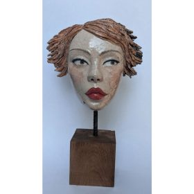 Sculpture céramique cuisson raku du visage d'une femme en bouche de canard